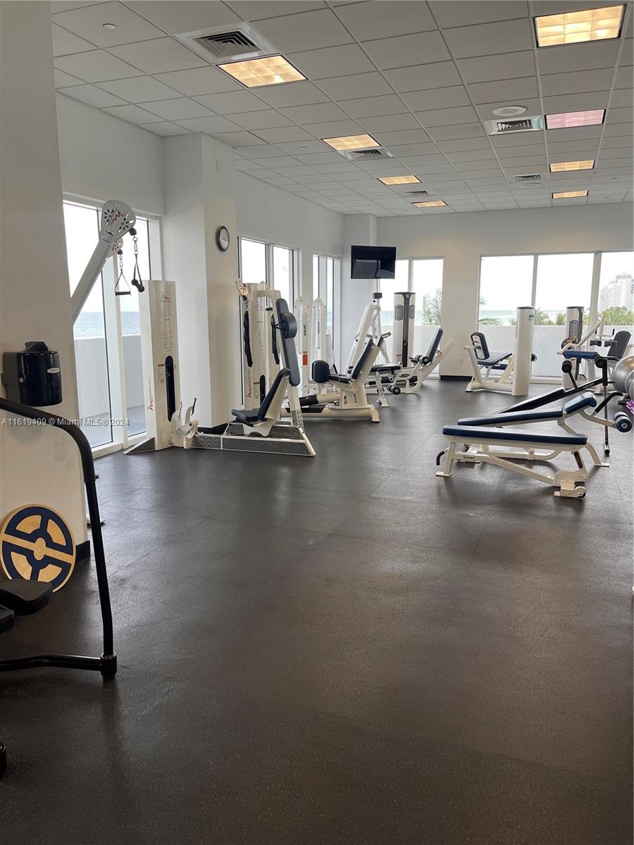 6365 Collins Avenue, Unit 2610 Miami Beach, FL 33141 - Photo 45 of 49 a view of a room with gym equipment