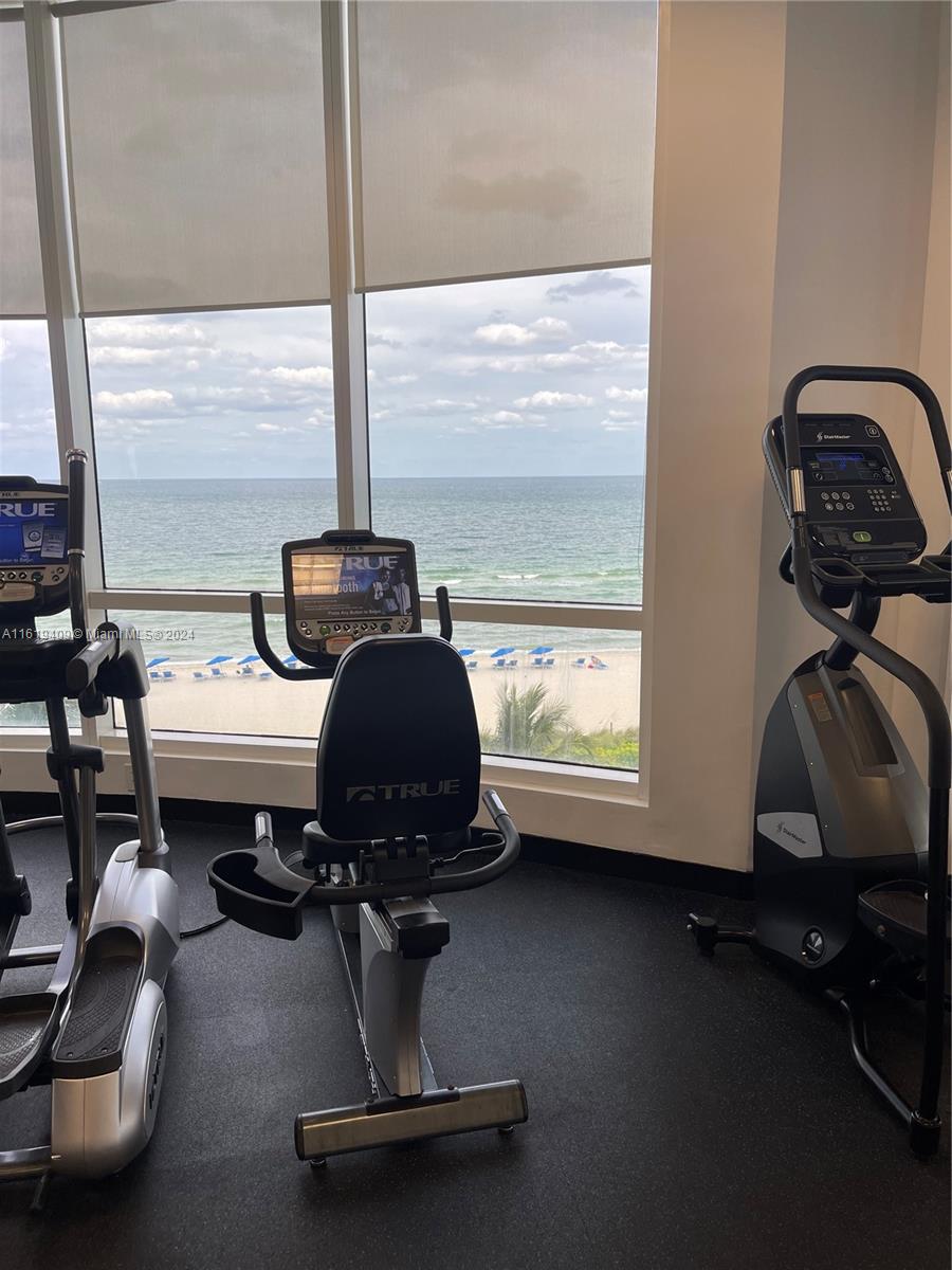 6365 Collins Avenue, Unit 2610 Miami Beach, FL 33141 - Photo 46 of 49 a room with gym equipment on the floor