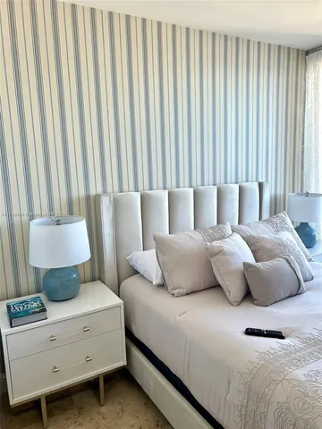 a living room with a couch and curtain