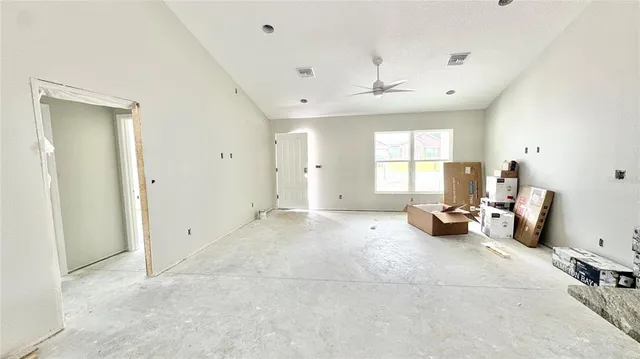 a view of a livingroom with a window and couch