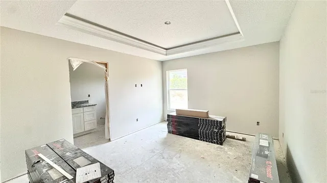 a room with a bed and a mirror