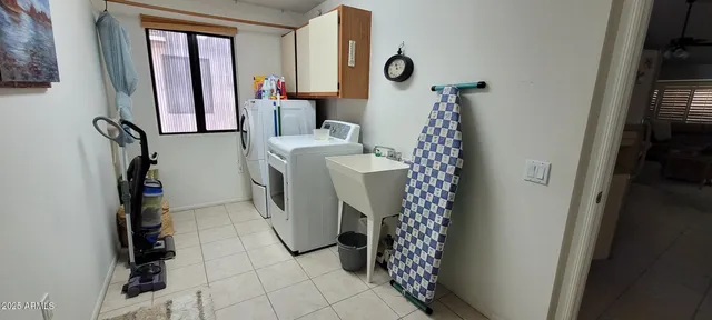 a view of a hallway with washer and dryer