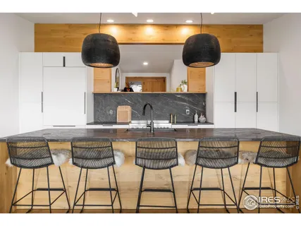 a kitchen with a table and chairs