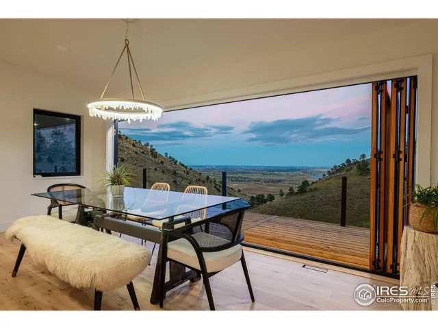 a balcony with table and chairs