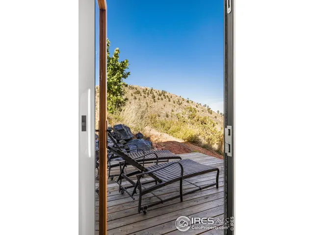 a view of a balcony with chair and table
