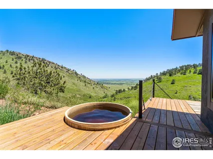 a view of balcony with a swimming pool