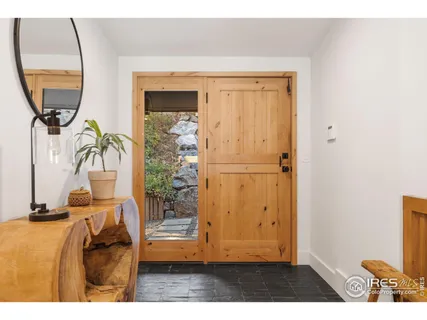 a view of a livingroom with furniture and a window