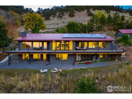 a view of swimming pool with outdoor seating and mountain view
