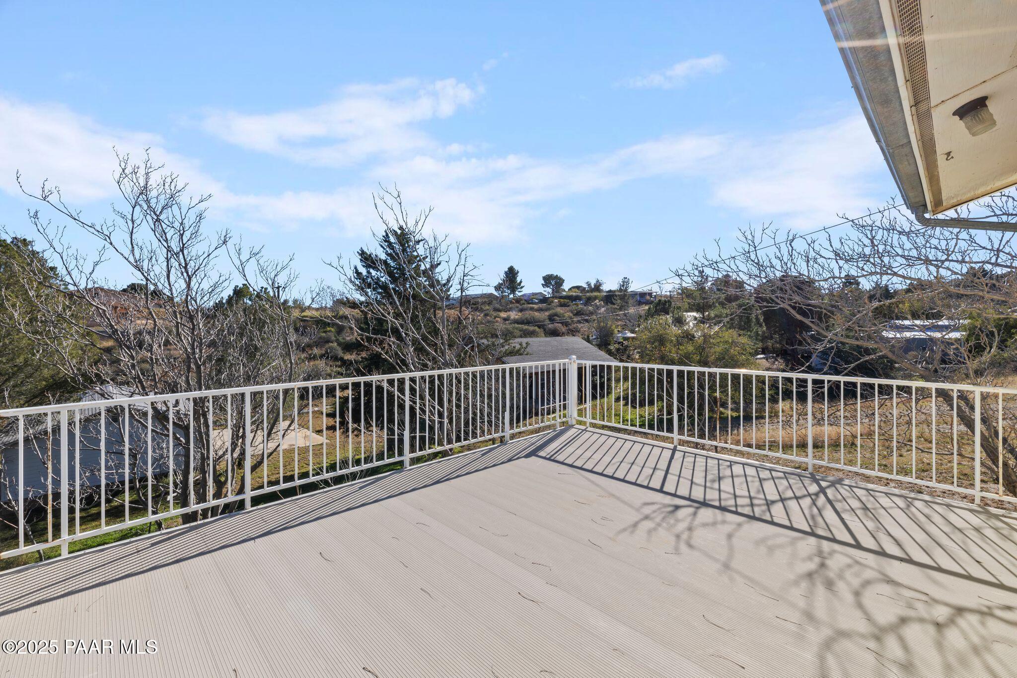 10231 Fir Street Mayer, AZ 86333 - Photo 12 of 50 a view of balcony with wooden floor and fence