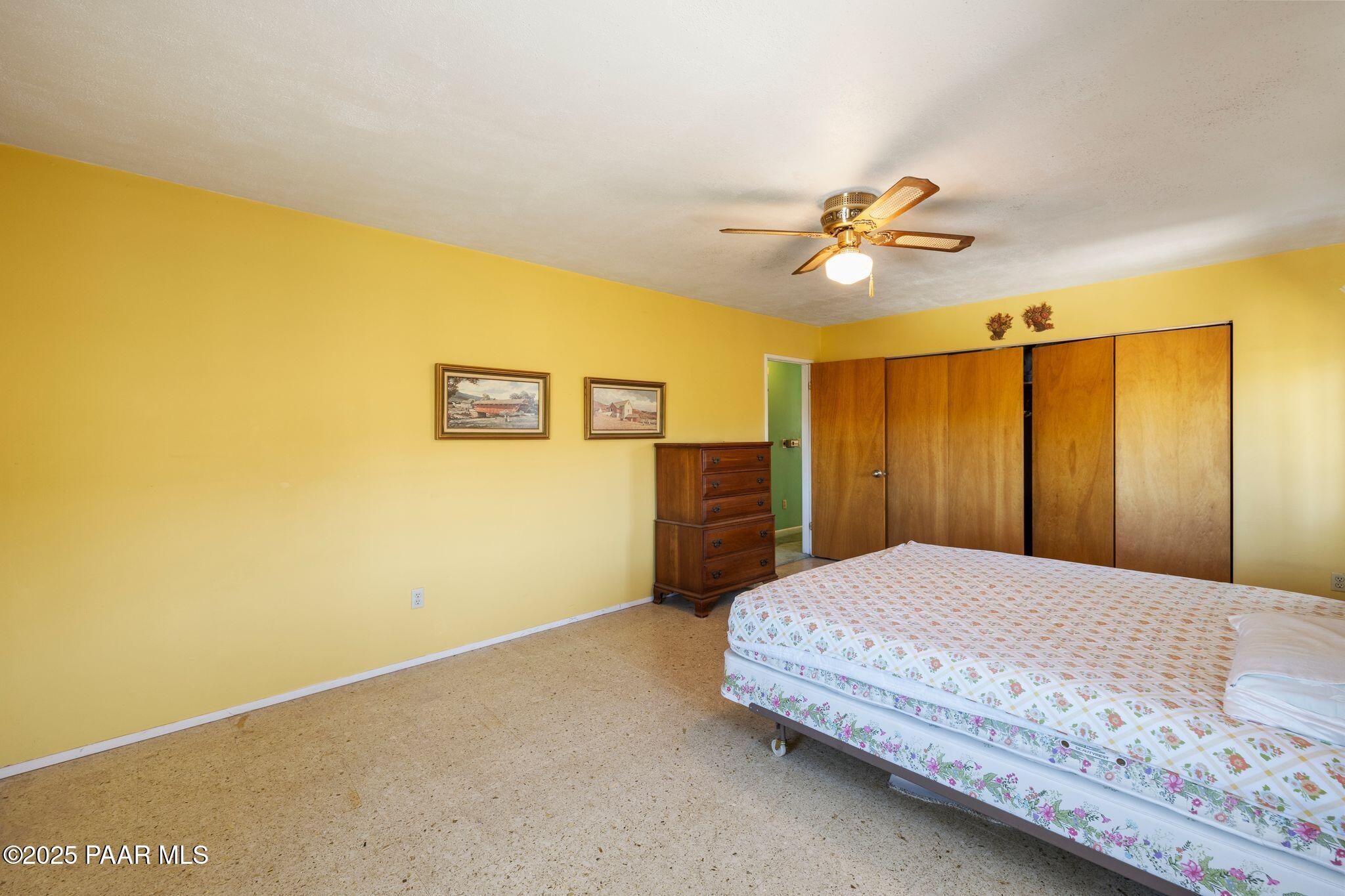 10231 Fir Street Mayer, AZ 86333 - Photo 19 of 50 a bedroom with a bed and a table