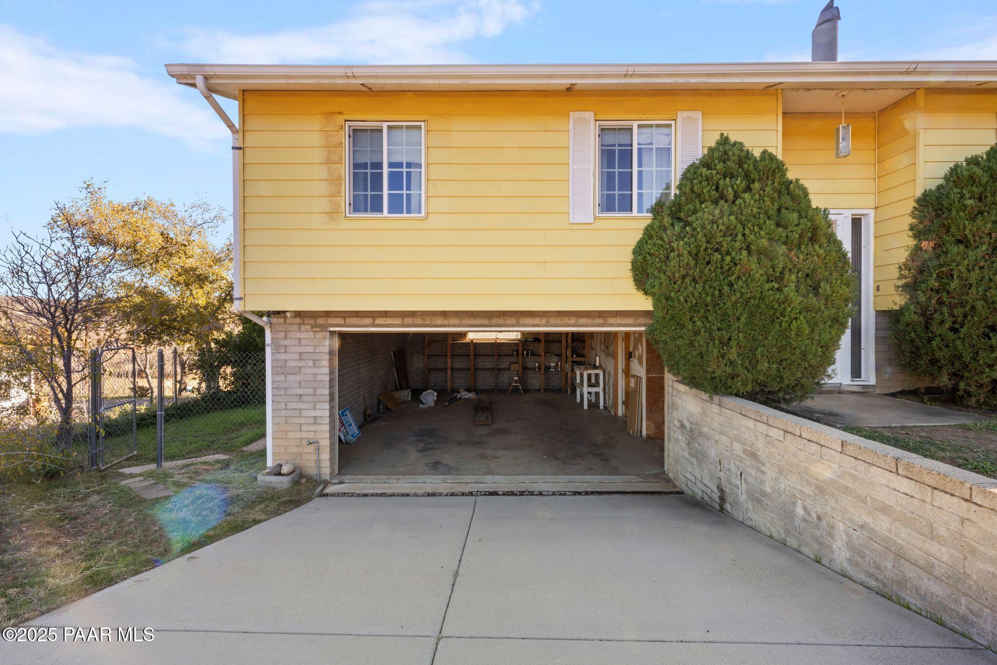 10231 Fir Street Mayer, AZ 86333 - Photo 2 of 50 a backyard of a house with outdoor seating