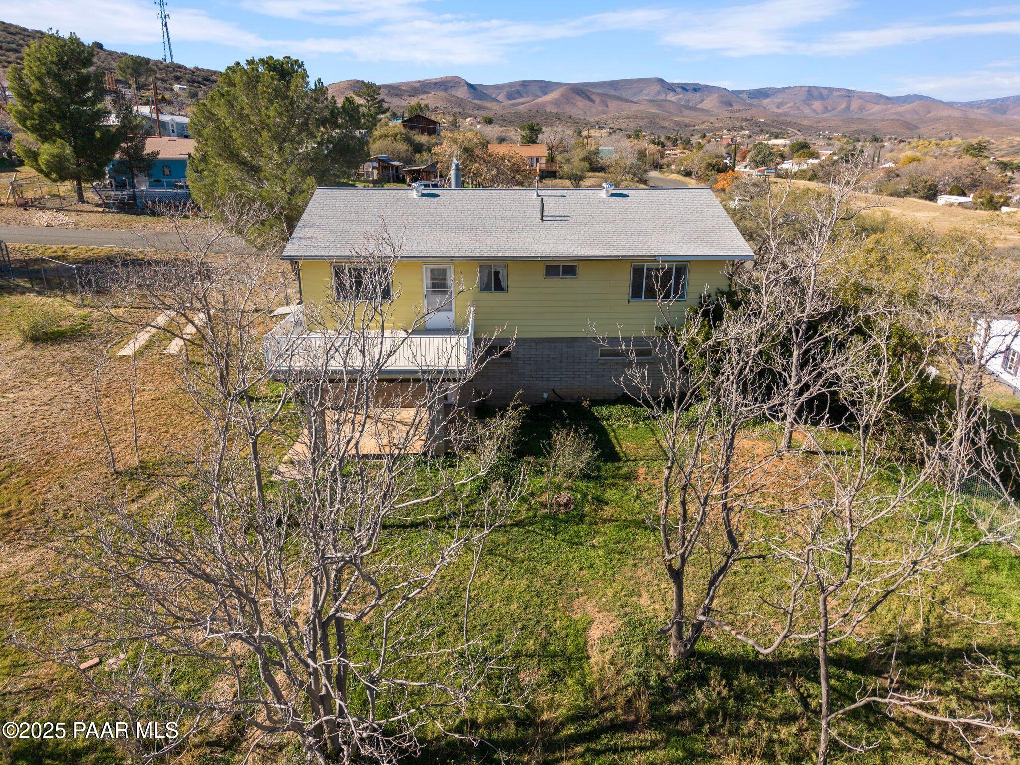 10231 Fir Street Mayer, AZ 86333 - Photo 49 of 50 a view of house with a garden