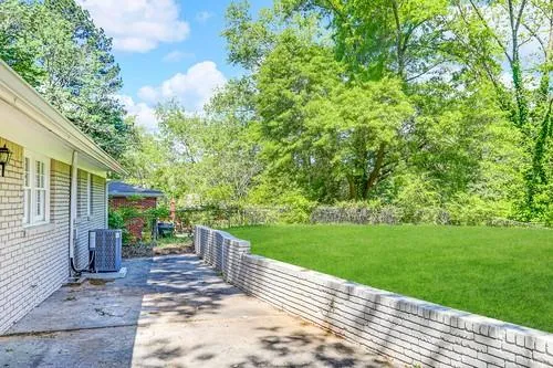 a view of a patio with a yard