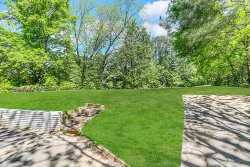 a view of a golf course with a lake