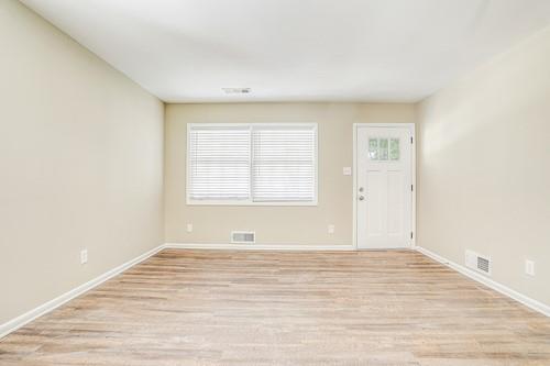 3539 Meadowridge Drive Southwest Atlanta, GA 30331 - Photo 20 of 25 a view of an empty room with wooden floor and a window