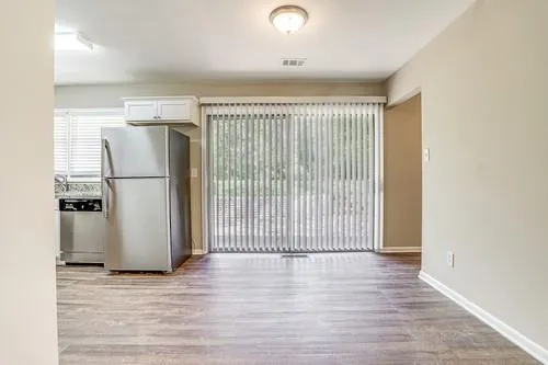 a view of a kitchen with a refrigerator a stove top oven and a refrigerator