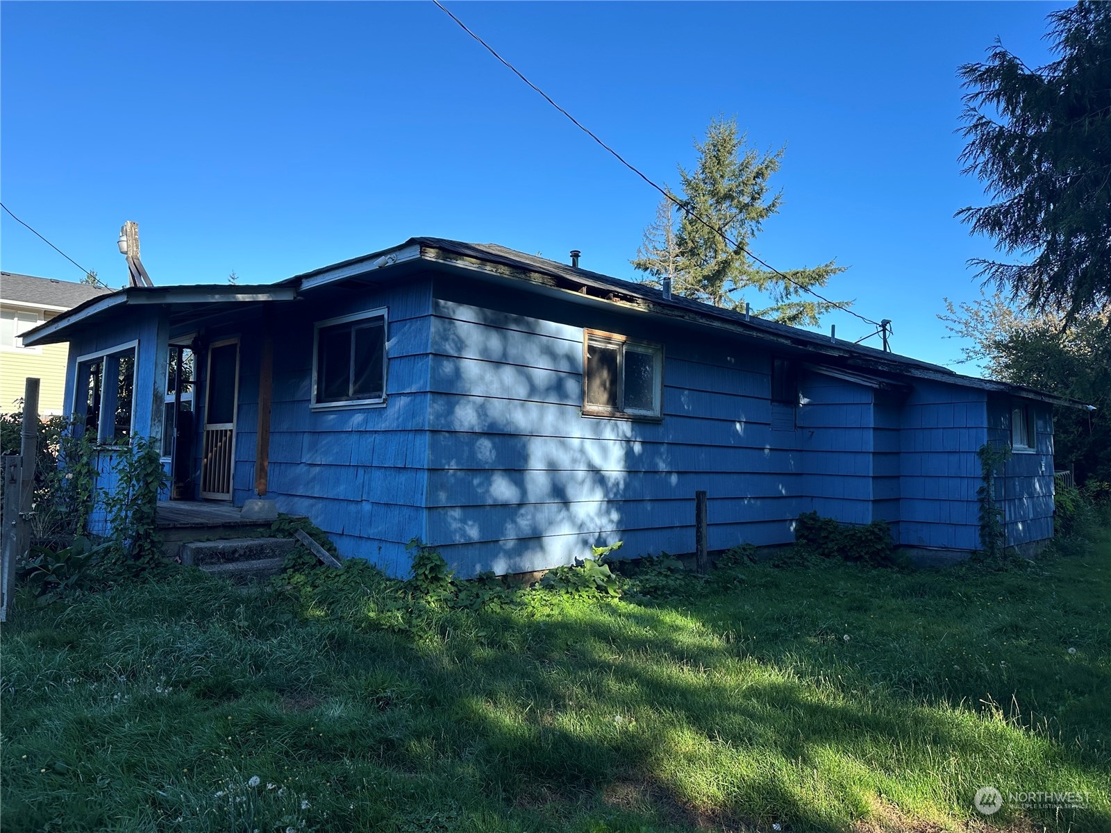 1793 Southeast Crawford Road Port Orchard, WA 98366 - Photo 1 of 8 a front view of a house with a garden