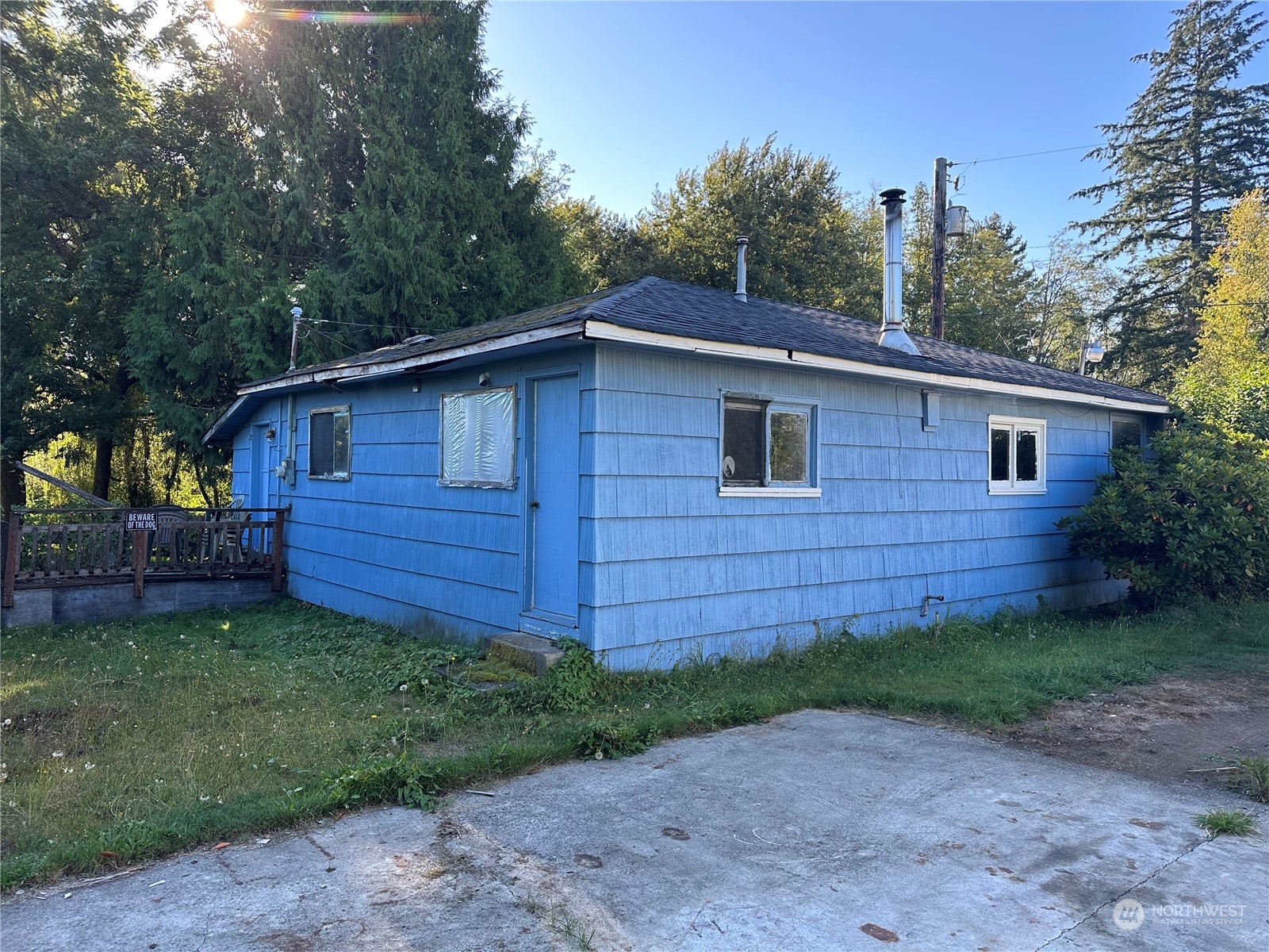 1793 Southeast Crawford Road Port Orchard, WA 98366 - Photo 2 of 8 a view of a backyard with a large tree