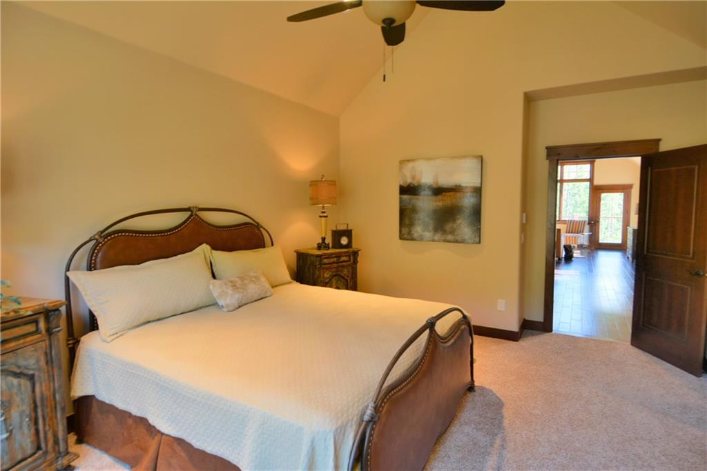 878 Independence Road, Unit 1A Keystone, CO 80435 - Photo 21 of 25 a bedroom with a bed and a mirror