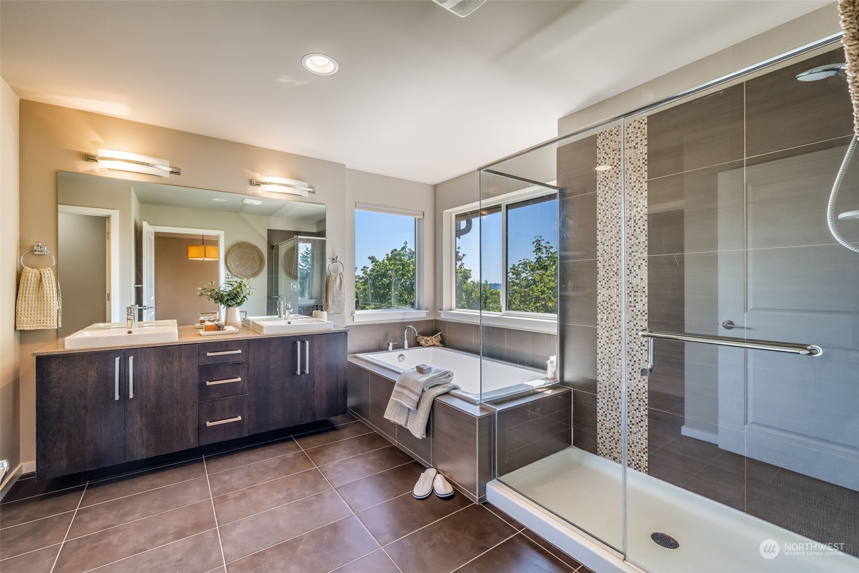 10014 Southeast 192nd Place Renton, WA 98055 - Photo 27 of 35 a bathroom with a tub sink and mirror