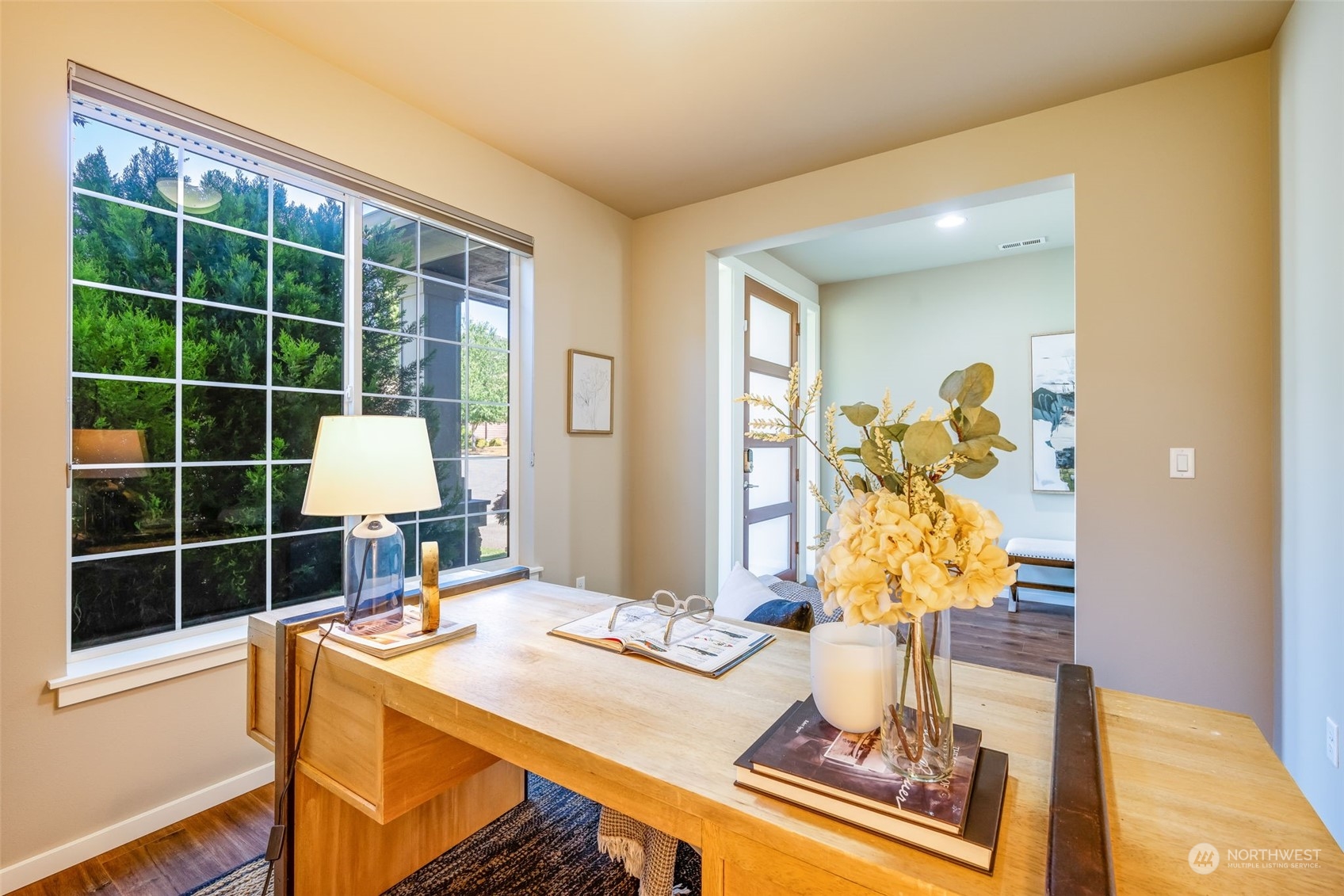 10014 Southeast 192nd Place Renton, WA 98055 - Photo 5 of 35 a view of a workspace with furniture and a window