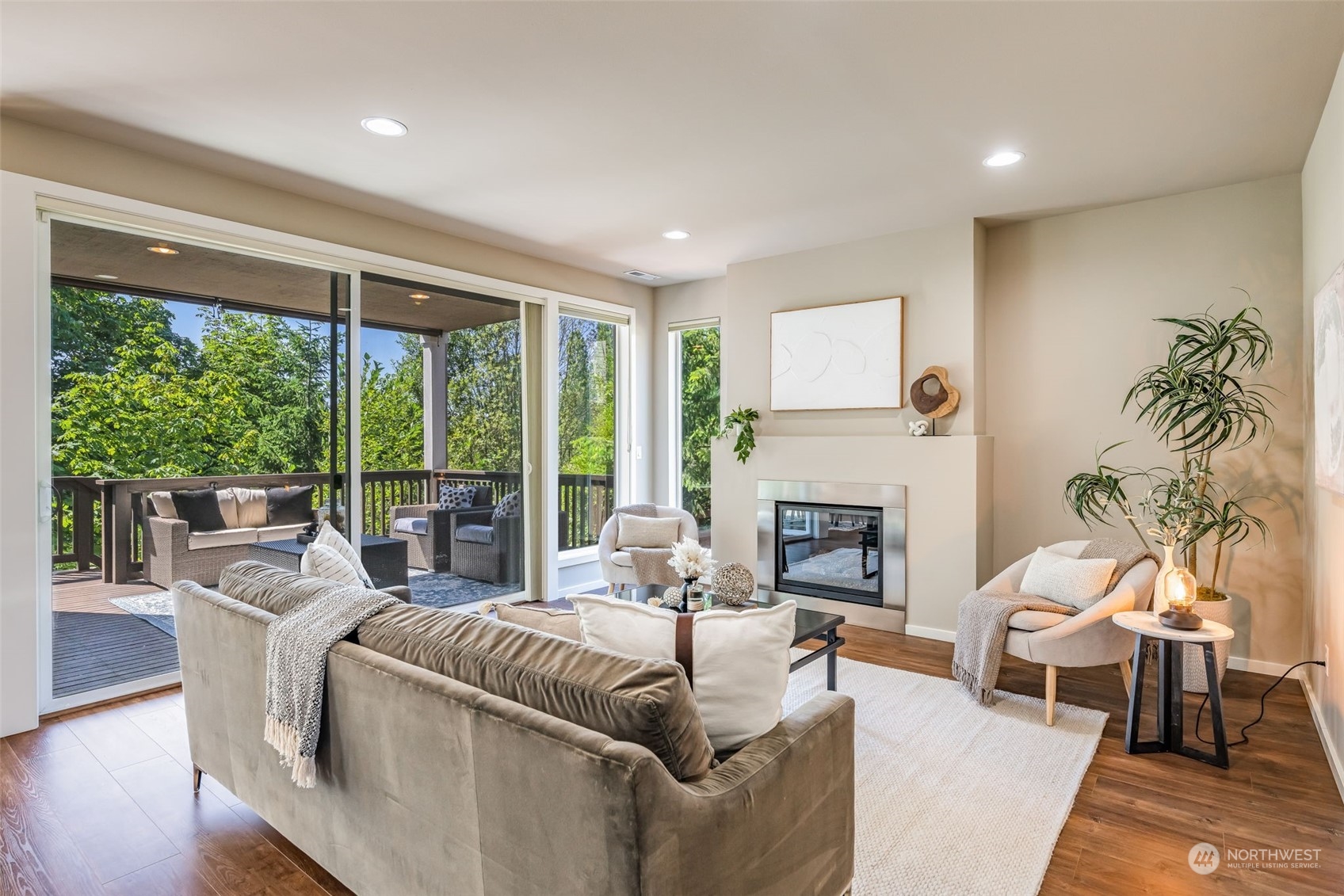 10014 Southeast 192nd Place Renton, WA 98055 - Photo 6 of 35 a living room with furniture a fireplace and a large window