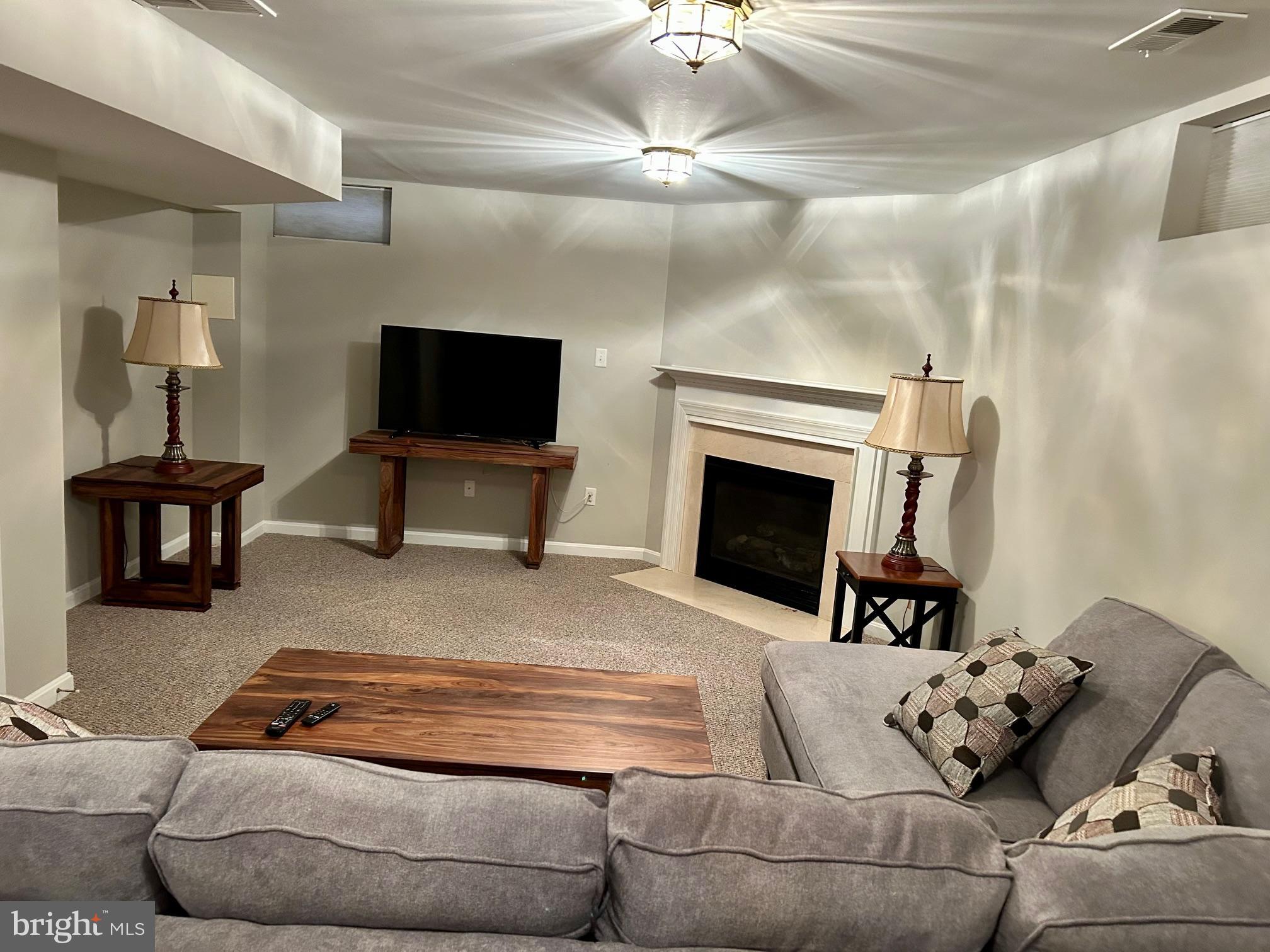 17741 Troyer Road White Hall, MD 21161 - Photo 12 of 26 a living room with furniture and a fireplace