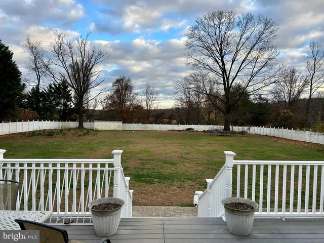 a view of yard with lake and trees