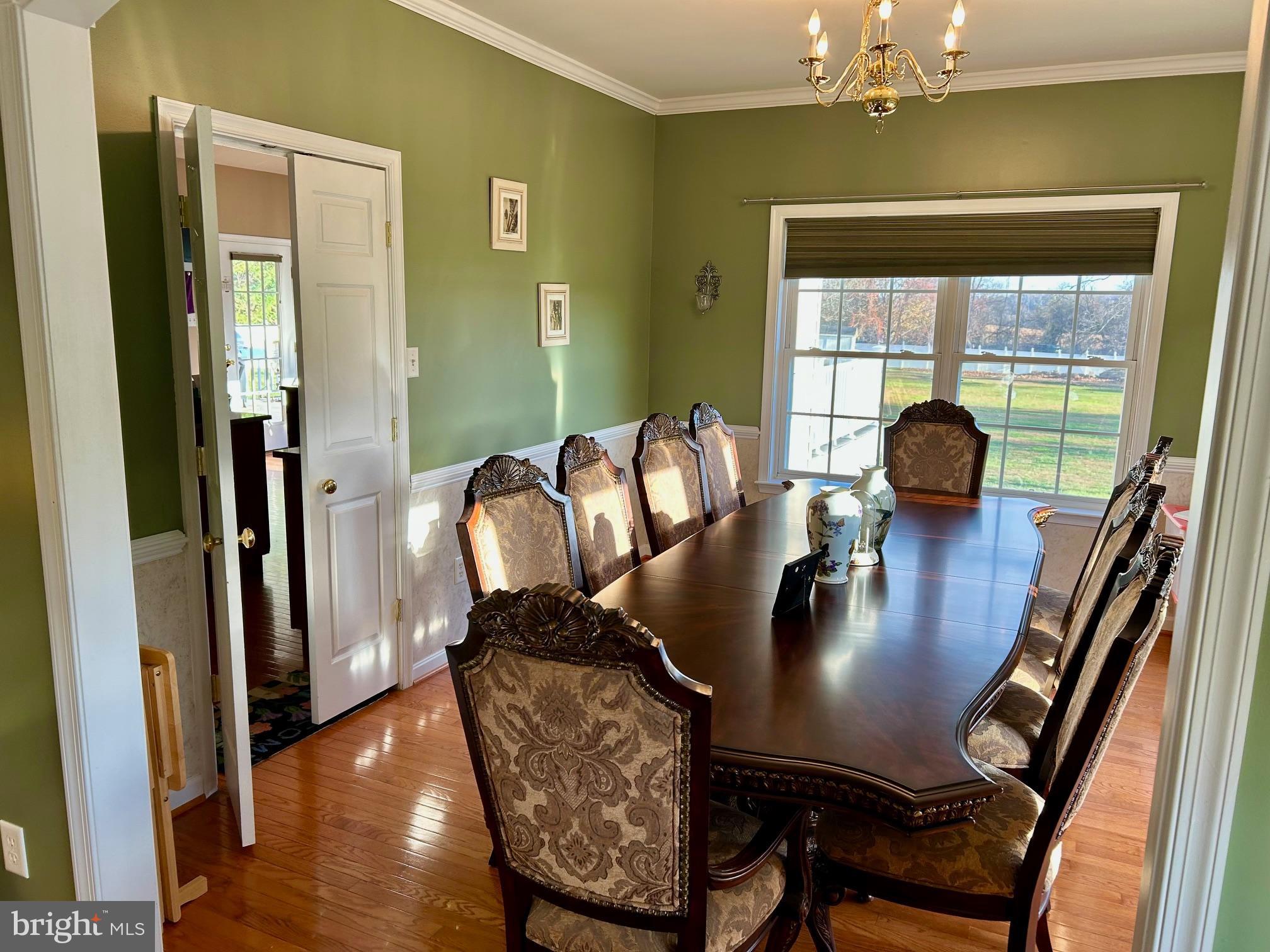 17741 Troyer Road White Hall, MD 21161 - Photo 5 of 26 a view of a dining room with furniture and wooden floor