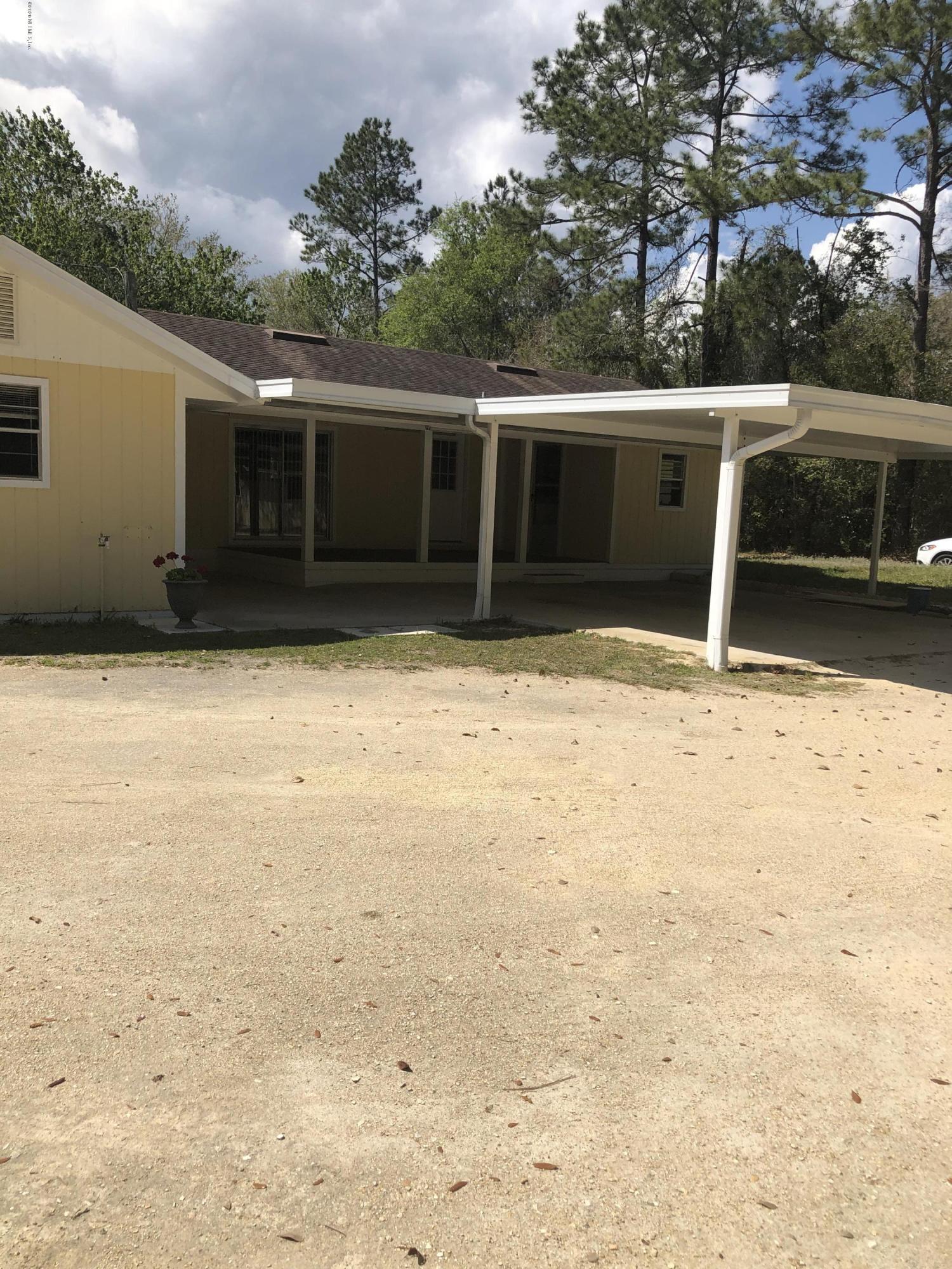 3210 Pacetti Road St. Augustine, FL 32092 - Photo 3 of 17 a backyard of a house