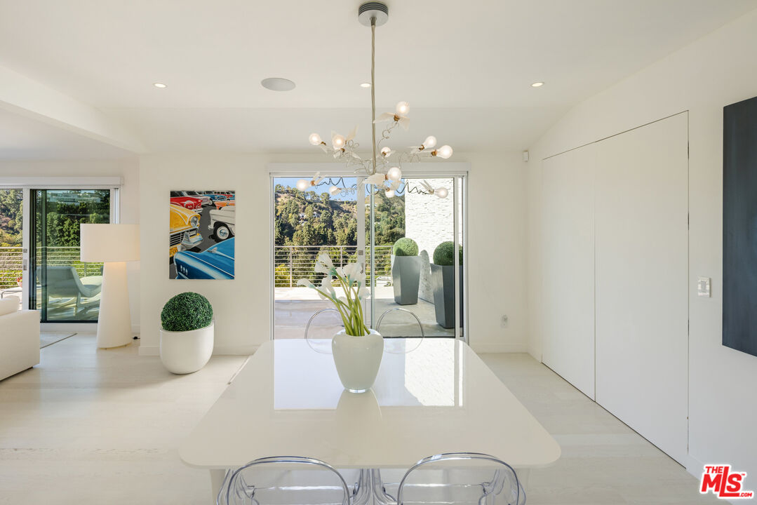 9422 Readcrest Drive Beverly Hills, CA 90210 - Photo 15 of 34 a living room with furniture and a floor to ceiling window