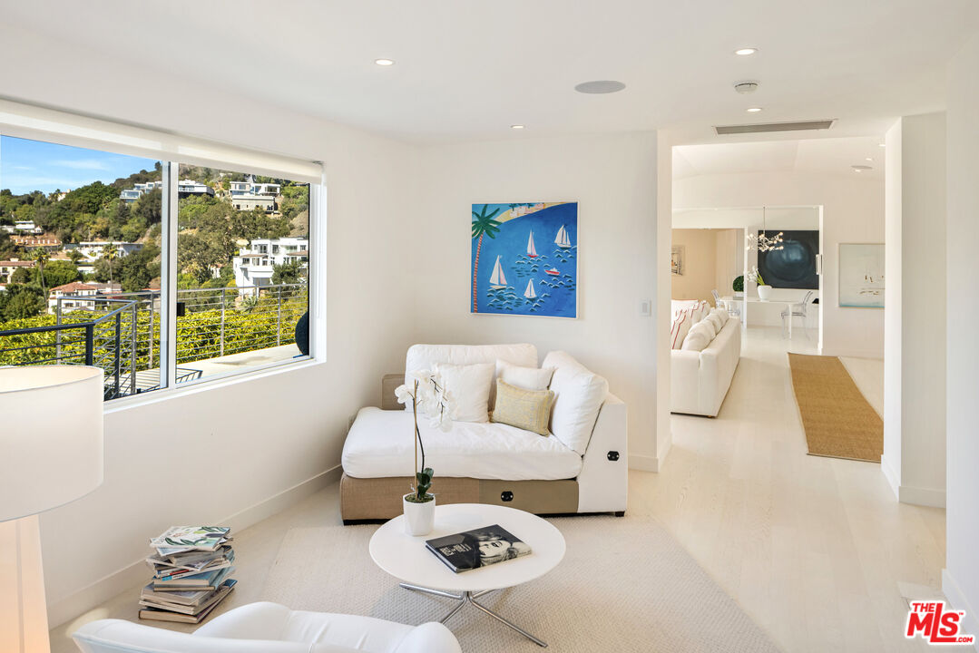 9422 Readcrest Drive Beverly Hills, CA 90210 - Photo 20 of 34 a living room with furniture and a large window