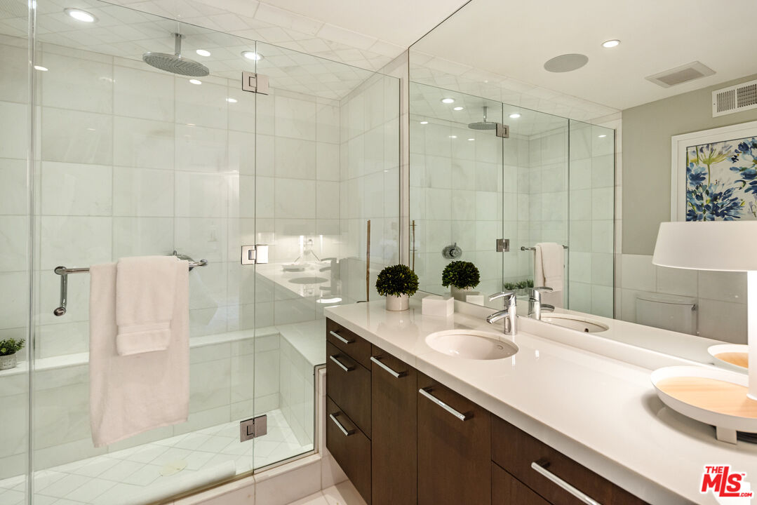 9422 Readcrest Drive Beverly Hills, CA 90210 - Photo 26 of 34 a bathroom with a double vanity sink mirror and shower