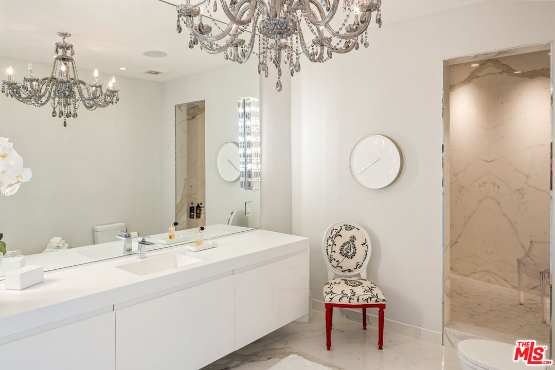 9422 Readcrest Drive Beverly Hills, CA 90210 - Photo 28 of 34 a bathroom with a sink and a mirror