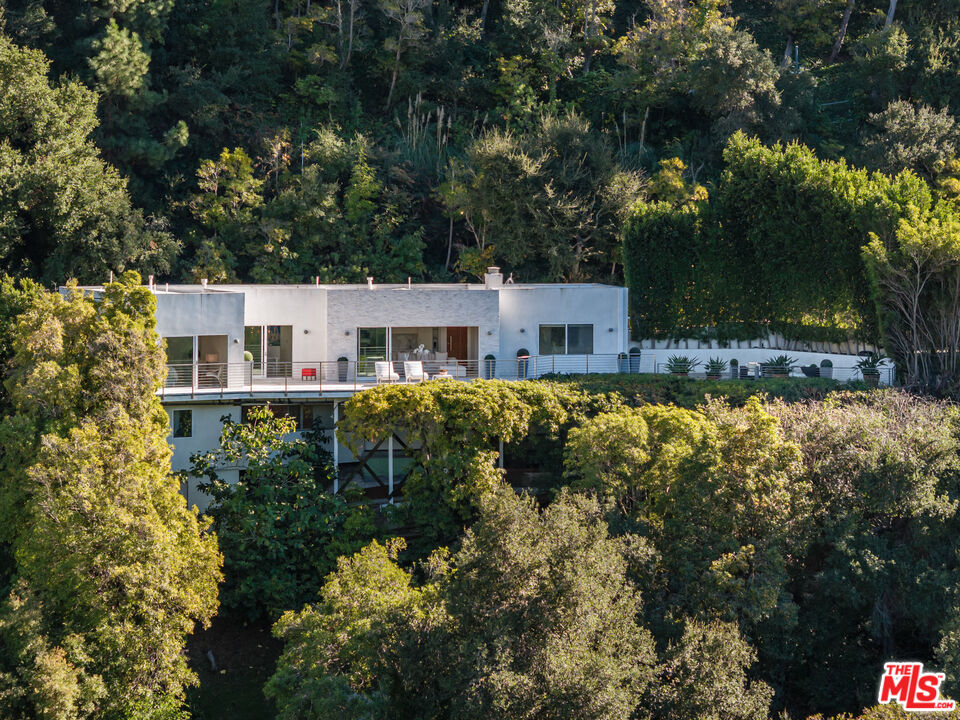 9422 Readcrest Drive Beverly Hills, CA 90210 - Photo 3 of 34 a view of house with a yard and swimming pool