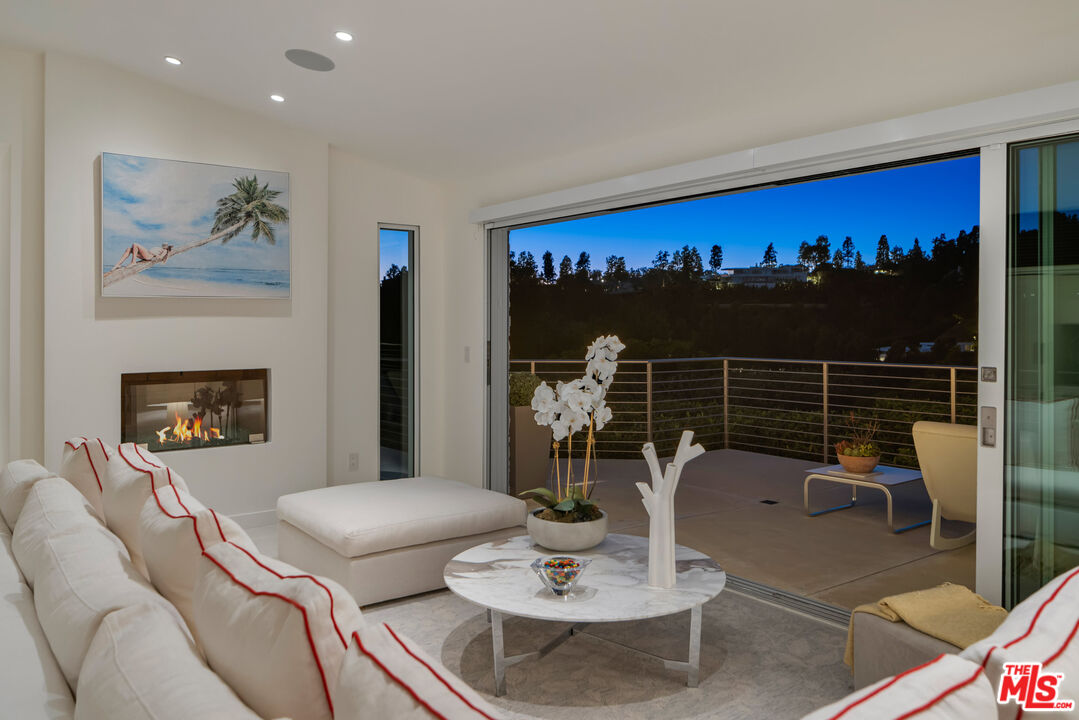 9422 Readcrest Drive Beverly Hills, CA 90210 - Photo 32 of 34 a living room with furniture and a fireplace