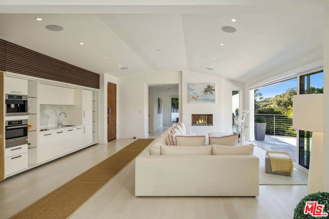 9422 Readcrest Drive Beverly Hills, CA 90210 - Photo 6 of 34 a living room with furniture and a flat screen tv