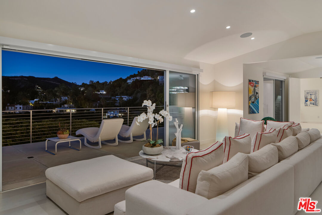9422 Readcrest Drive Beverly Hills, CA 90210 - Photo 7 of 34 a living room with furniture a window and a fireplace