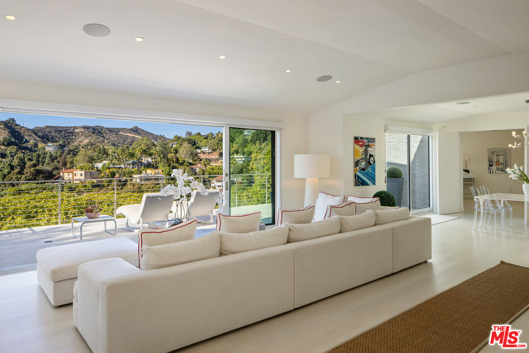 9422 Readcrest Drive Beverly Hills, CA 90210 - Photo 9 of 34 a living room with furniture and a large window