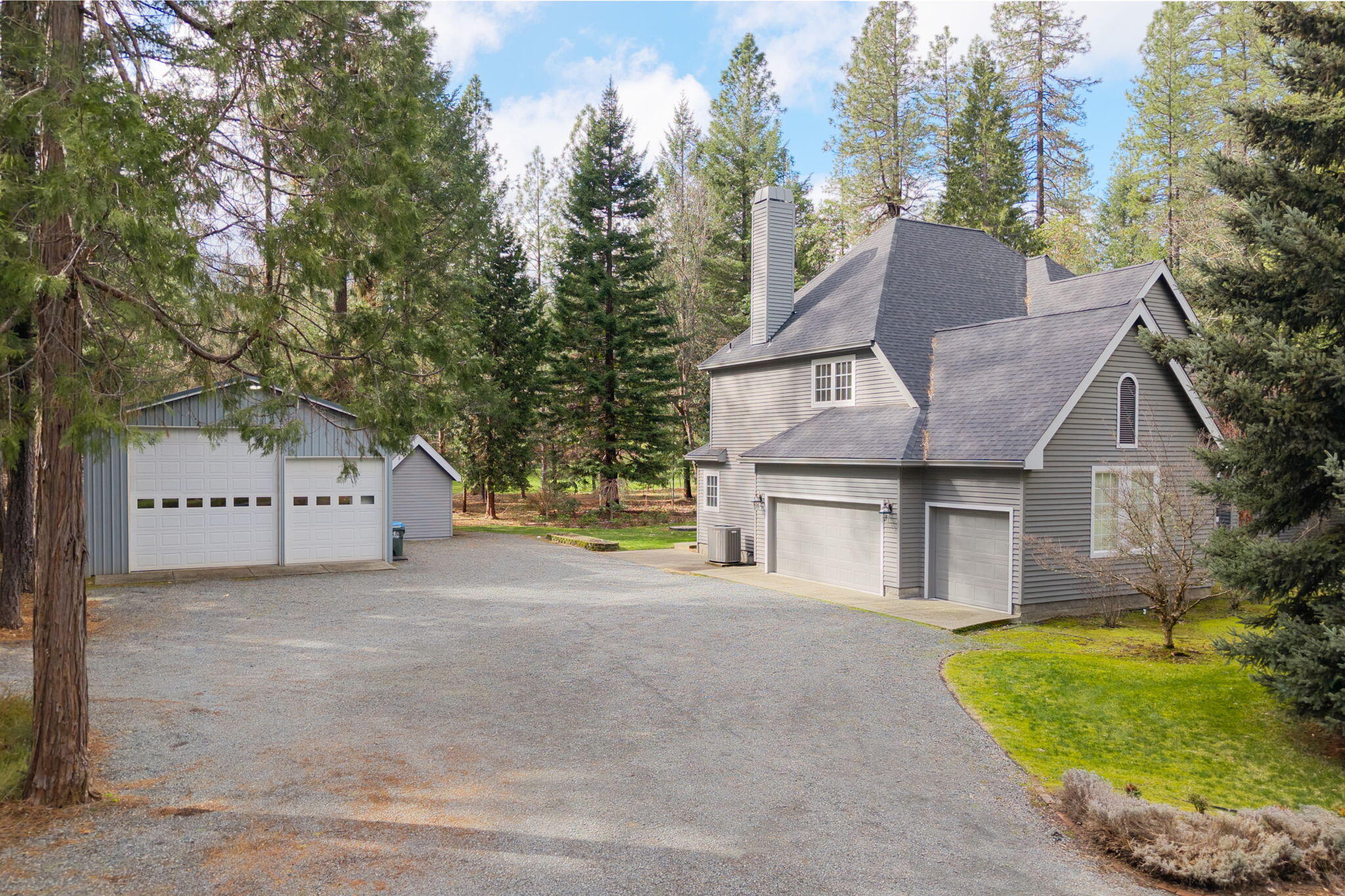 7081 Redthorne Road Rogue River, OR 97537 - Photo 3 of 58 a view of a house with a yard and large tree