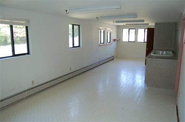 218 County Road Freetown, MA 02717 - Photo 25 of 30 an empty room with wooden floor and windows