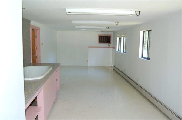 218 County Road Freetown, MA 02717 - Photo 27 of 30 a view of a kitchen with a sink and dishwasher with wooden floor