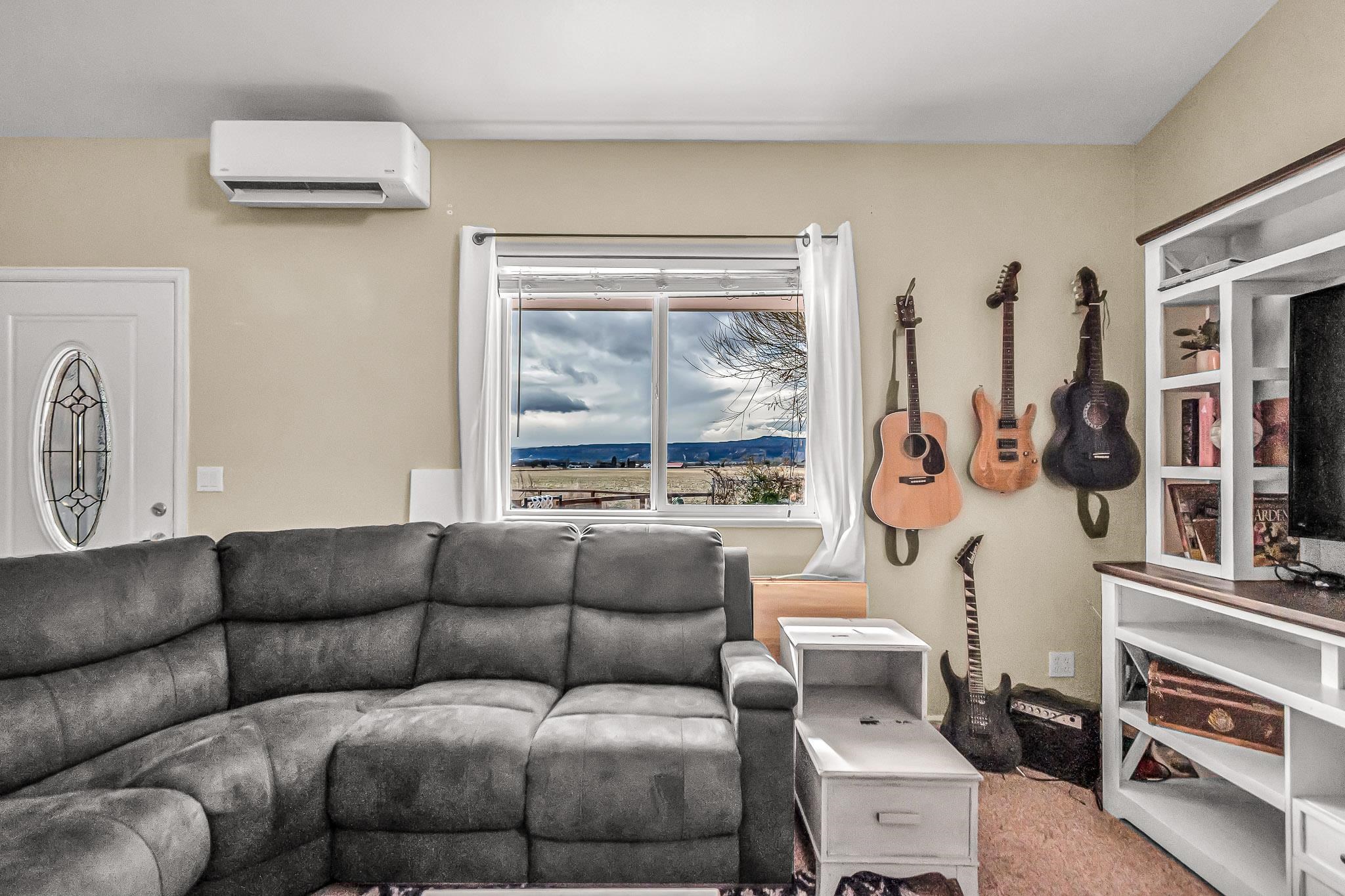 1473 19 Road Fruita, CO 81521 - Photo 13 of 41 a living room with furniture and a window