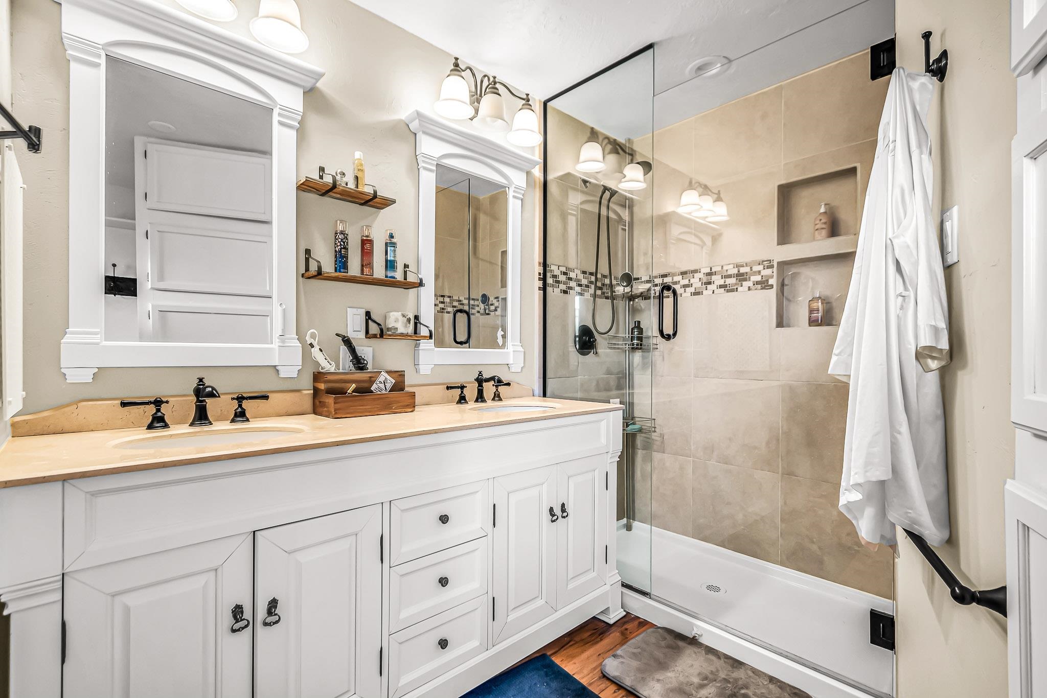 1473 19 Road Fruita, CO 81521 - Photo 19 of 41 a bathroom with a double vanity sink mirror and shower