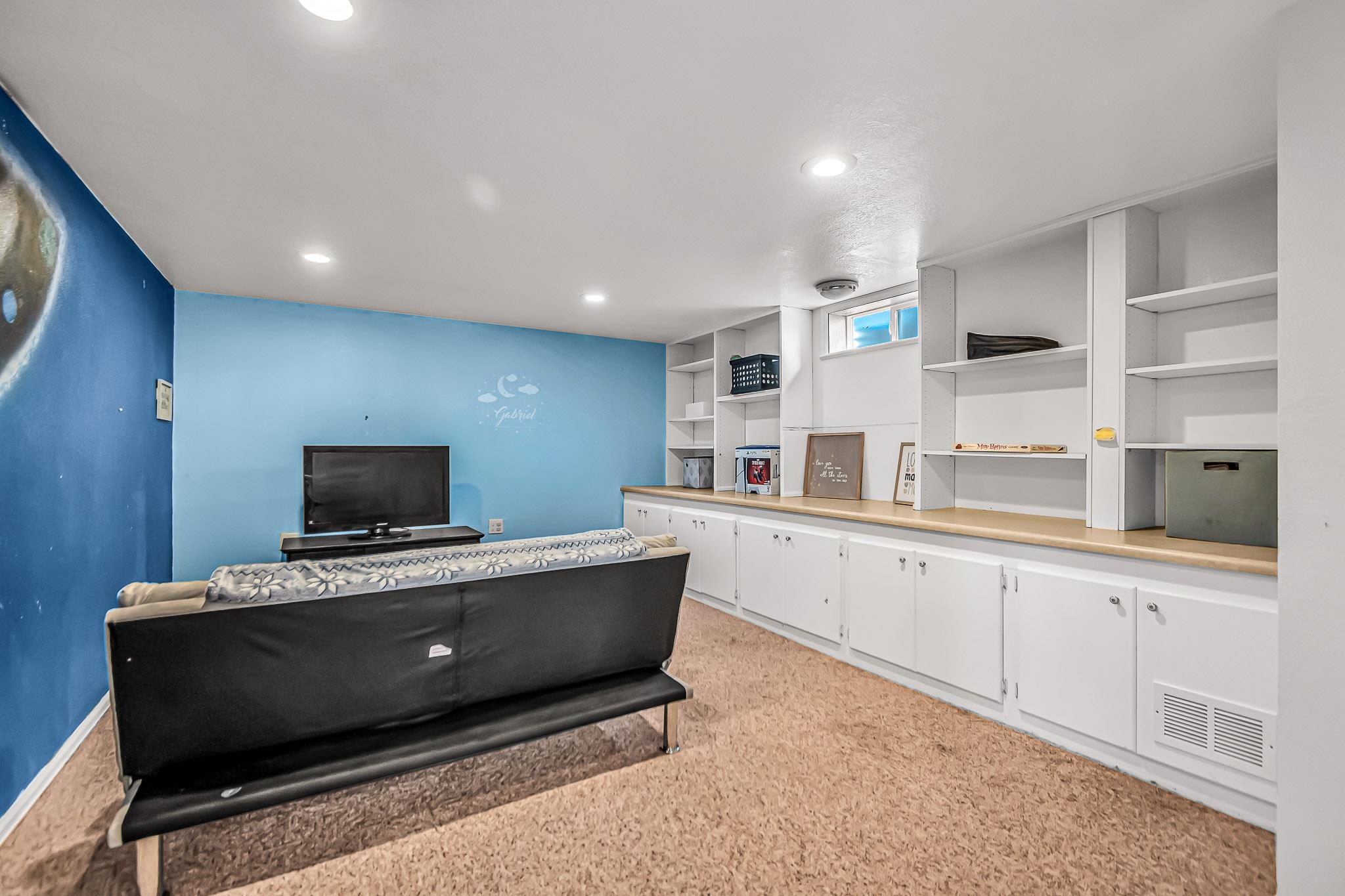 1473 19 Road Fruita, CO 81521 - Photo 22 of 41 a living room with stainless steel appliances kitchen island granite countertop a sink and cabinets