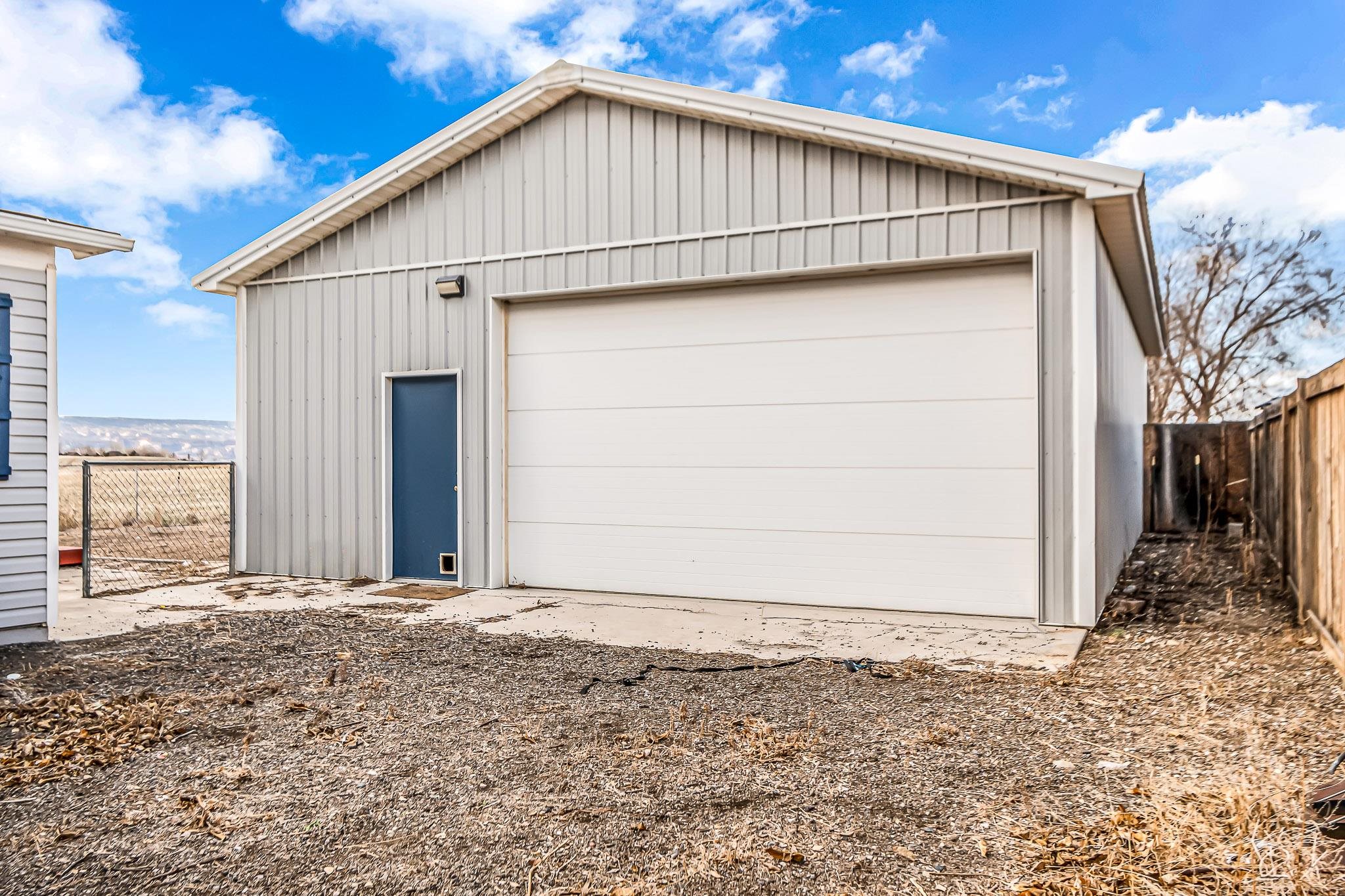 1473 19 Road Fruita, CO 81521 - Photo 25 of 41 a view of a house with a backyard