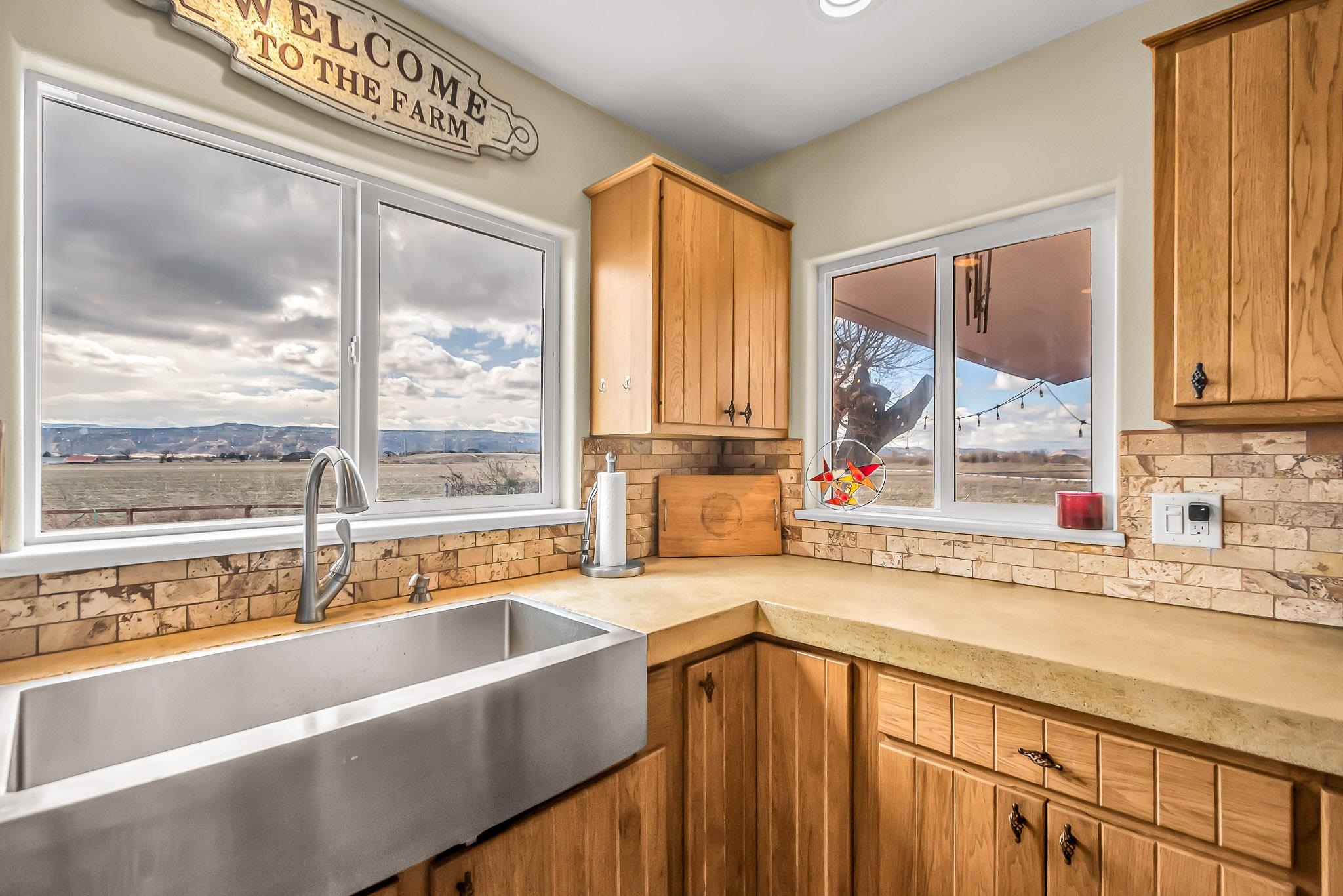 1473 19 Road Fruita, CO 81521 - Photo 35 of 41 a bathroom with a granite countertop sink and a large window