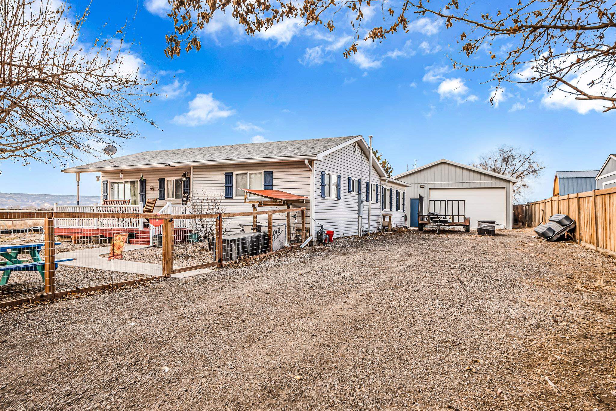 1473 19 Road Fruita, CO 81521 - Photo 36 of 41 a view of a house with backyard and sitting area