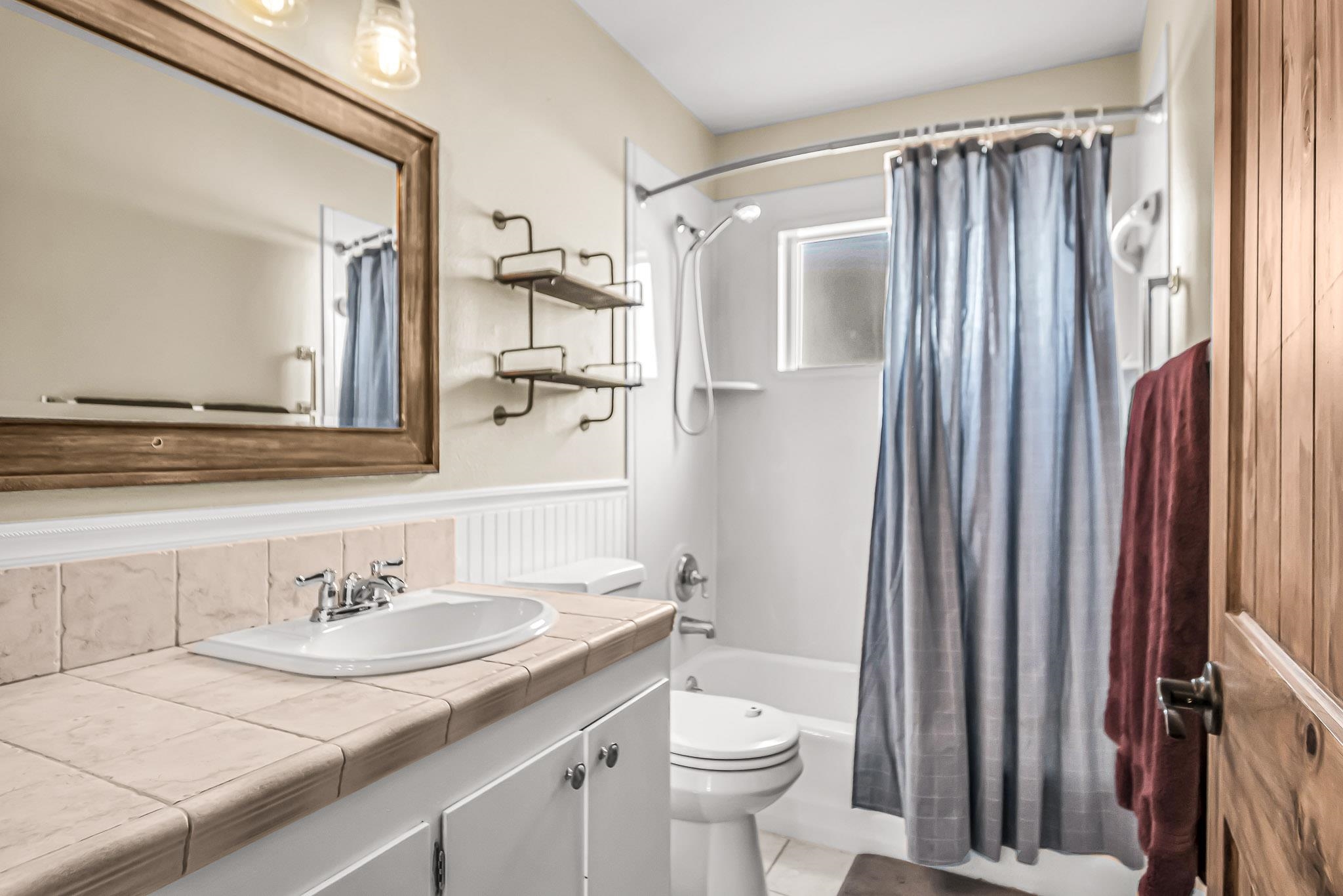 1473 19 Road Fruita, CO 81521 - Photo 4 of 41 a bathroom with a granite countertop sink toilet and shower