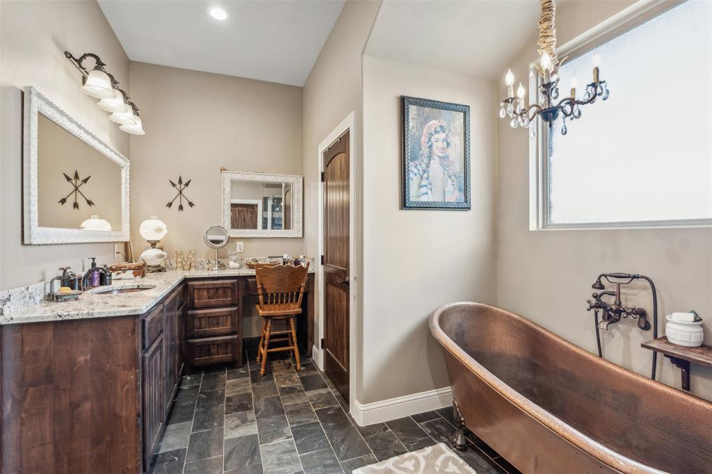 4180 North Smith Road Fate, TX 75087 - Photo 17 of 27 a room with furniture a piano and a chandelier